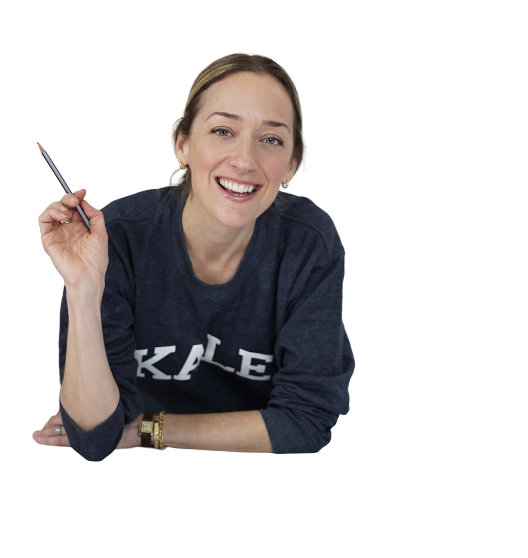 Kris Carr smiling and holding a pen