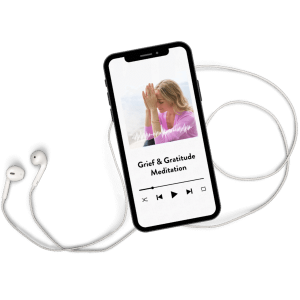 Grief and Gratitude Meditation on a phone with earbuds